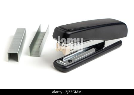 Black professional stapler isolated on white background. Stock Photo