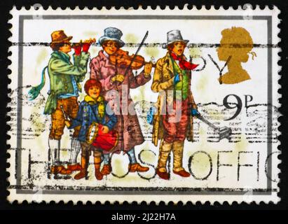 GREAT BRITAIN - CIRCA 1978: a stamp printed in the Great Britain shows Christmas Carolers, circa 1978 Stock Photo