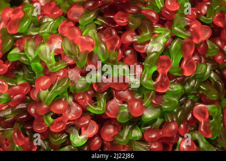 Multicolored jelly stick candies textured background. Stock Photo