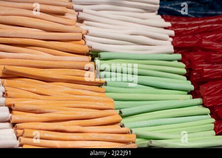 Candies with jelly and sugar. colorful array of different childs sweets and treats. Bright party background. Stock Photo