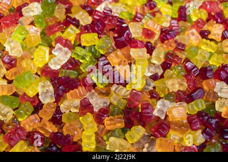 Multicolored jelly stick candies textured background. Stock Photo
