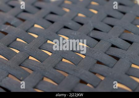 Mesh from plastic rattan garden furniture Stock Photo