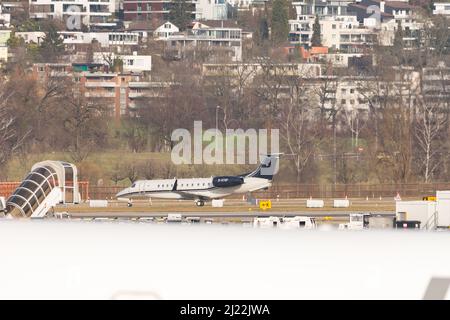 Zurich, Switzerland, February 24, 2022 Embraer Legacy 650 aircraft is waiting for its take off clearance on runway 32 Stock Photo