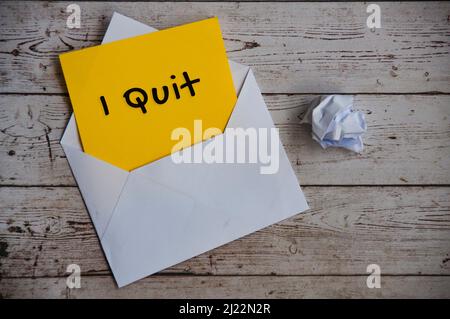 I quit text on yellow notepad in an envelope. Employment and resignation concept Stock Photo