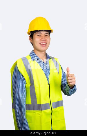 Young asian engineer smiling and thumbs up isolated on white background. (With Clipping path) Stock Photo