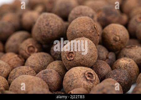 Pile of dried allspice fruits spices macro shot. Stock Photo