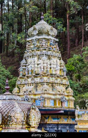 Sita Eliya, Sri Lanka - October 25, 2014: The Rising Gopuram Or Pinnacle of the Sita Hindu Temple Among the Foliage at Sita Eliya Among the Central Hi Stock Photo