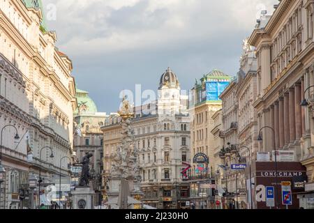 Vienna, Austria - April 26, 2015:  people enjoy shopping at the most famous pedestrian zone the Graben street in vienna in afternoon light. Stock Photo