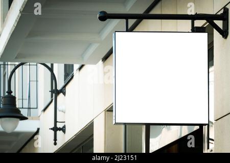 Mock up. Empty white rectangular signage on the wall of classical architecture building in european city Stock Photo