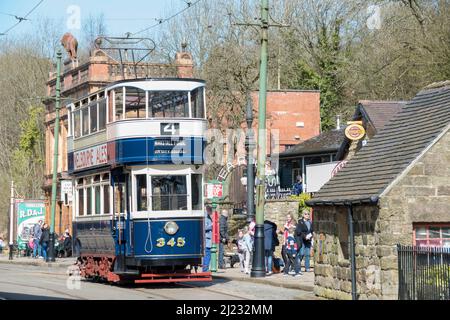 Derbyshire, UK – 5 April 2018: The 345 double decker vintage tram at the Red Lion tram stop, Crich Tramway Village Stock Photo