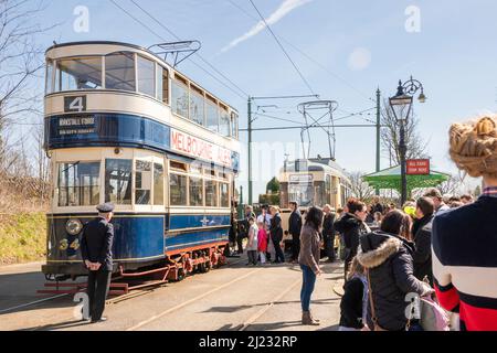 Derbyshire, UK – 5 April 2018: A long queue await the chance to board the No 4 Kirkstall forge double decker tram at Crich Tramway Village National Tr Stock Photo