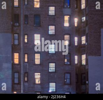 Illuminated apartment windows in Chelsea in New York on Friday, March 25, 2022. (© Richard B. Levine) Stock Photo