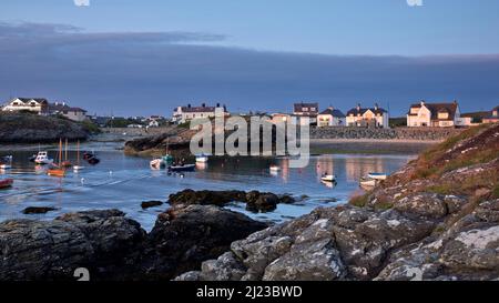 Porth Diana with houses of Trearddur Bay in late evening light on the western coast of Holy Island part of the Isle of Anglesey (Sir Ynys Mon) North W Stock Photo