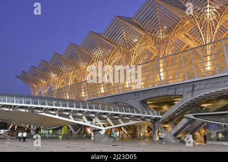 Gare do Oriente - modern transport hub, building exterior illuminated at dusk. Located in Parque das Nacoes district of Lisbon Portugal. Stock Photo