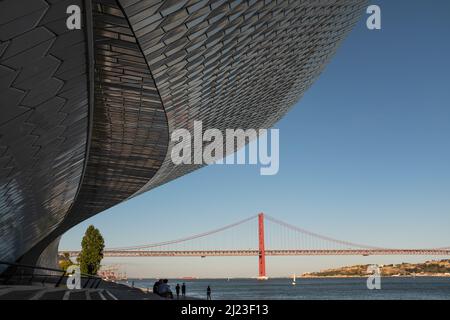 Tourists at Museum of Art Architecture and Technology with Tagus River, Lisbon, Portugal