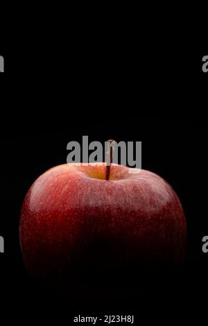 Macro photography of a red apple on a black background Stock Photo