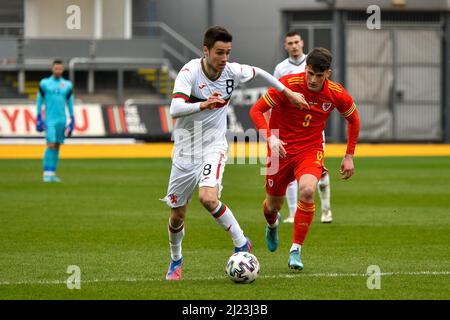 Newport, Wales. 29 March, 2022. Ilia Gruev of Bulgaria U21 (left) under pressure from Jack Vale of Wales U21 during the UEFA European Under-21 Championship Qualifier Group E match between Wales U21 and Bulgaria U21 at Rodney Parade in Newport, Wales, UK on 29, March 2022. Credit: Duncan Thomas/Majestic Media. Stock Photo