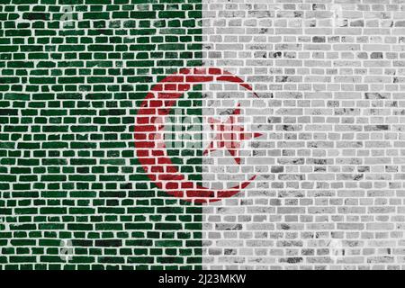 Close-up on a brick wall with the flag of Algeria painted on it. Stock Photo