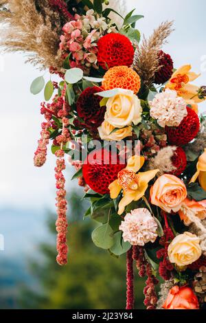 Elements of wedding arch in rustic style on mountains background Stock Photo