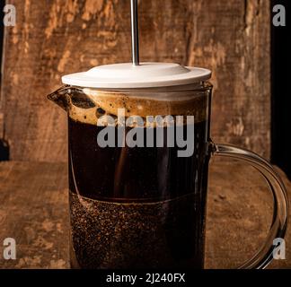 Coffee in french press with wooden background Stock Photo