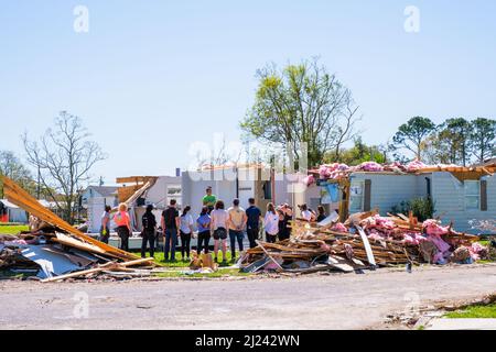 ARABI, LA, USA - MARCH 26, 2022: Volunteers gathered to clean up tornado damage from March 22, 2022 tornado in New Orleans suburb Stock Photo
