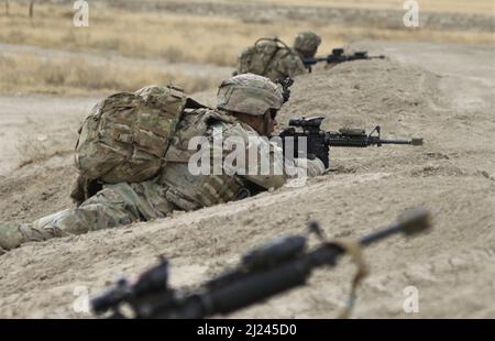 Soldiers assigned to C Troop, 3rd Squadron, 61st Cavalry Regiment, 2nd Stryker Brigade, 4th Infantry Division, provide security for their formation while conducting movement to an observation post during Operation Steel Eagle on Fort Carson, Colo., Mar. 29, 2022.  Operation Steel Eagle is a brigade-wide exercise designed to integrate maneuver forces, artillery fires, and intelligence collection. U.S. Army photo by Maj. Jason Elmore. Stock Photo