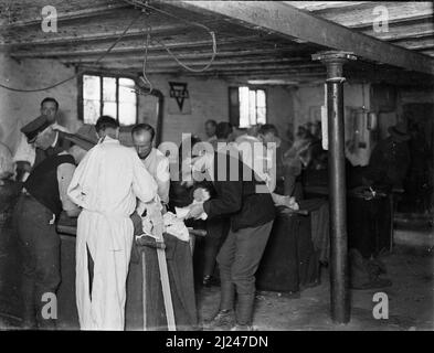 A team of the 2nd Field Ambulance inside a makeshift hospital during World War I. Stock Photo