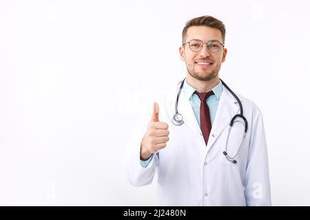 Portrait of confident young medical doctor on white background. The doctor shows the ok symbol Stock Photo