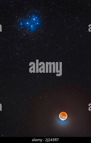 Moon below the Pleiades Stock Photo