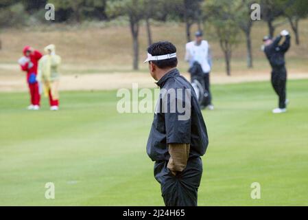 Nov 26, 2004-Seogwipo, South Korea-KJ Choi stand look competitor at a PGA TOUR Championship 2 round seventh green in Jeju Island on Nov 26, 2004, South Korea. Stock Photo