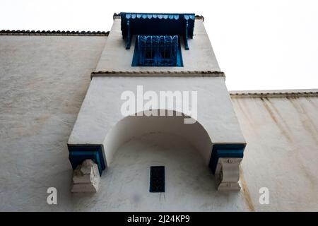 View of a typical window and balcony in the Mediterranean city of Sidi Bou Said, a town in northern Tunisia located about 20 km from the capital Tunis Stock Photo