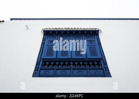 View of a typical window and balcony in the Mediterranean city of Sidi Bou Said, a town in northern Tunisia located about 20 km from the capital Tunis Stock Photo