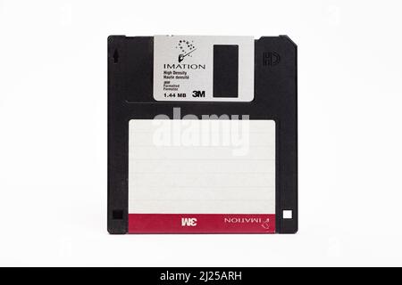 Close-Up Of Floppy Disk Against White Background Stock Photo
