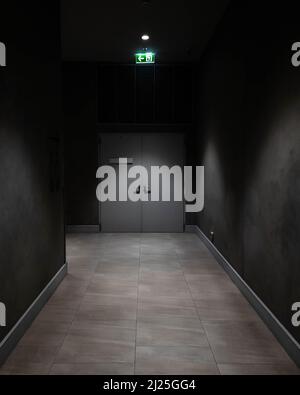 Emergency fire exit way corridor in commercial building. Stock Photo