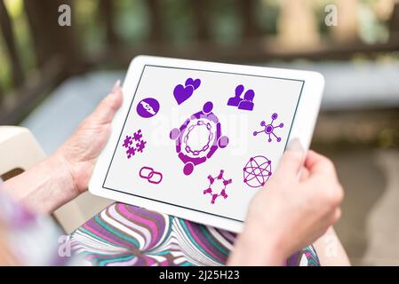 Friendship concept shown on a tablet held by a woman Stock Photo