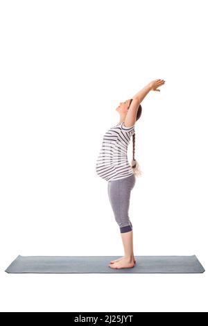 Pregnant woman doing yoga asana ... Stock Photo