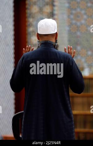 Muslim praying. Prayer room at the Geneva mosque. Stock Photo