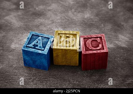 Vintage alphabet blocks on wooden background Stock Photo