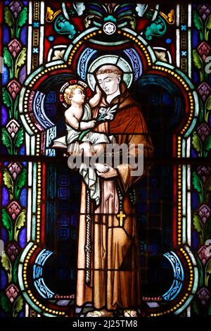 Almudena Cathedral. The crypt.  Stained glass window. Anthony of Padua with Infant Jesus in arms. Stock Photo