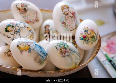 Beautiful Easter goose eggs on the plate. Decorated and painted eggs for festival. Hand made print Stock Photo