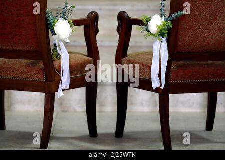 Two chairs in church. Wedding ceremony. Stock Photo