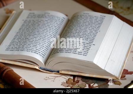 Open torah on a table. Jewish book. Stock Photo
