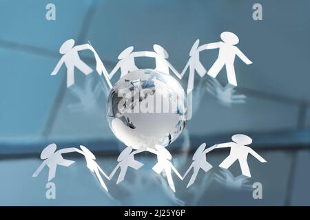 business men working around a globe Stock Photo - Alamy