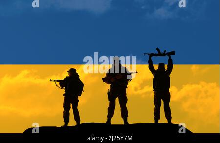 Flag of the Ukraine in original proportions. Concept of the Conflict between Ukraine and Russia. Military silhouettes fighting scene dark toned foggy background. Stock Photo