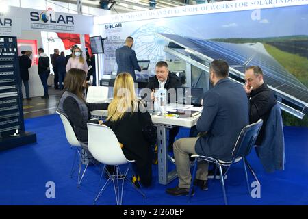 Businessmen communicating during an exhibition CISOLAR. October 21, 2021. Kiev, Ukraine Stock Photo