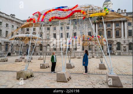 London, UK. 30th Mar, 2022. The Arks of Gimokudan at Somerset House by Philippine artist Leeroy New. It will be on view until 26 April to mark the occasion of Earth Day. It is first UK installation, and takes form as three upturned ships, constructed using plastic waste and recycled materials. The installation draws on the culture and mythologies of the artist's home nation, a country at the frontline of the climate emergency. Credit: Guy Bell/Alamy Live News Stock Photo