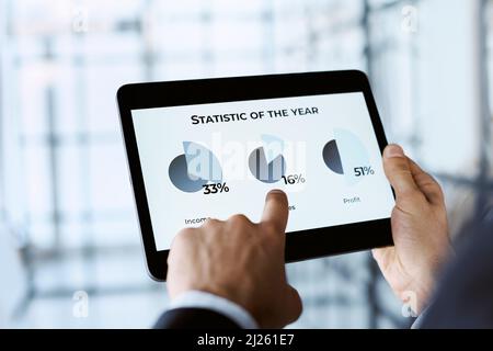 business man analyzing the annual data on cryptocurrency. Stock Photo