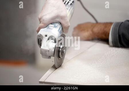 Construction site.  New house. Man working with a circular saw. Stock Photo