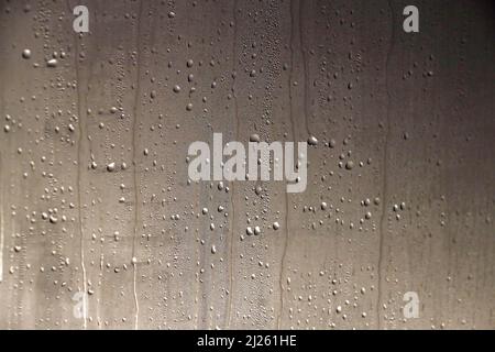 Natural water drop texture on a window. Stock Photo