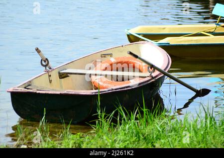 Boat on the beach at sunrise time. Stock Photo